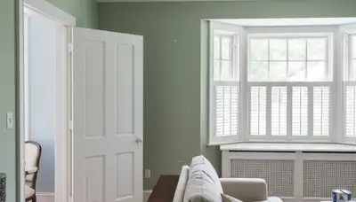 Professional interior trim painting in Champaign, IL highlighting detailed woodwork and clean finish lines